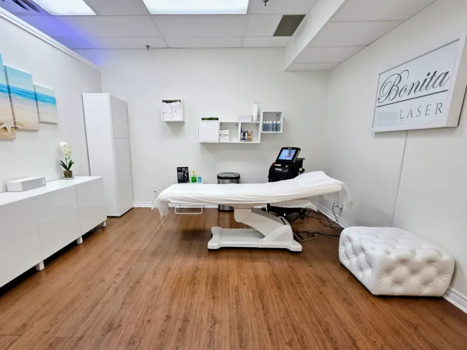 Bliss Room at Bonita Laser in Mississauga with treatment bed, laser equipment and Bonita Laser wall sign